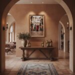 Mediterranean hallway with arches and wooden console table