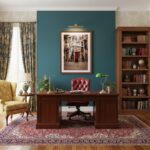 Traditional home office with wooden desk and bookshelf