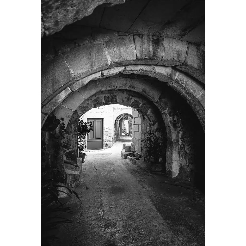 Stone archway corridor in historic alley