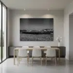 Minimalist dining room with large black-and-white wall art