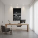 Minimalist office with wooden desk and windmill artwork
