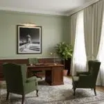 Elegant home office with green chairs and wooden desk