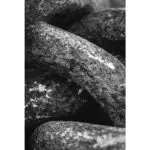Black-and-white close-up of rough stacked stones