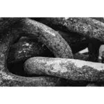 Close-up of weathered interlocking metal chain links