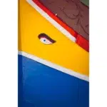 Colorful boat hull with painted eye detail