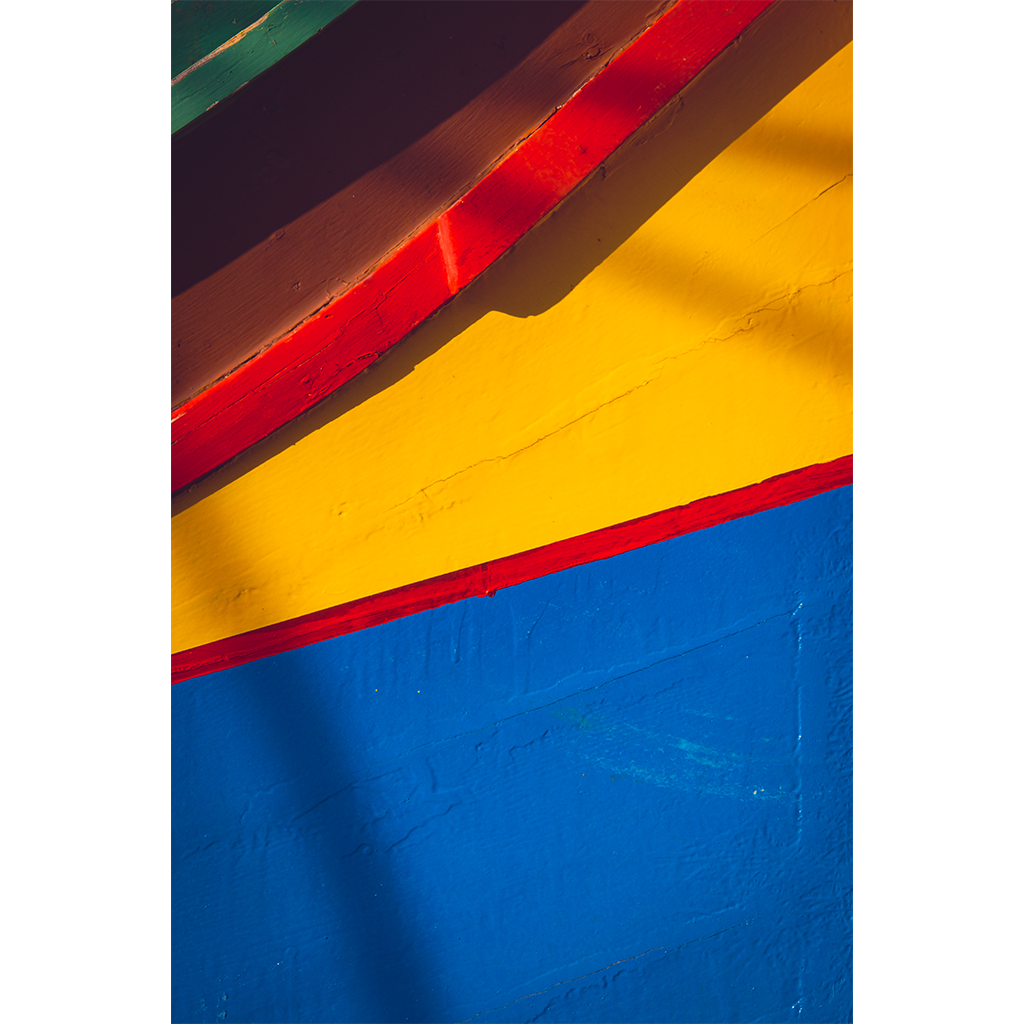 Colorful painted wooden boat hull close-up