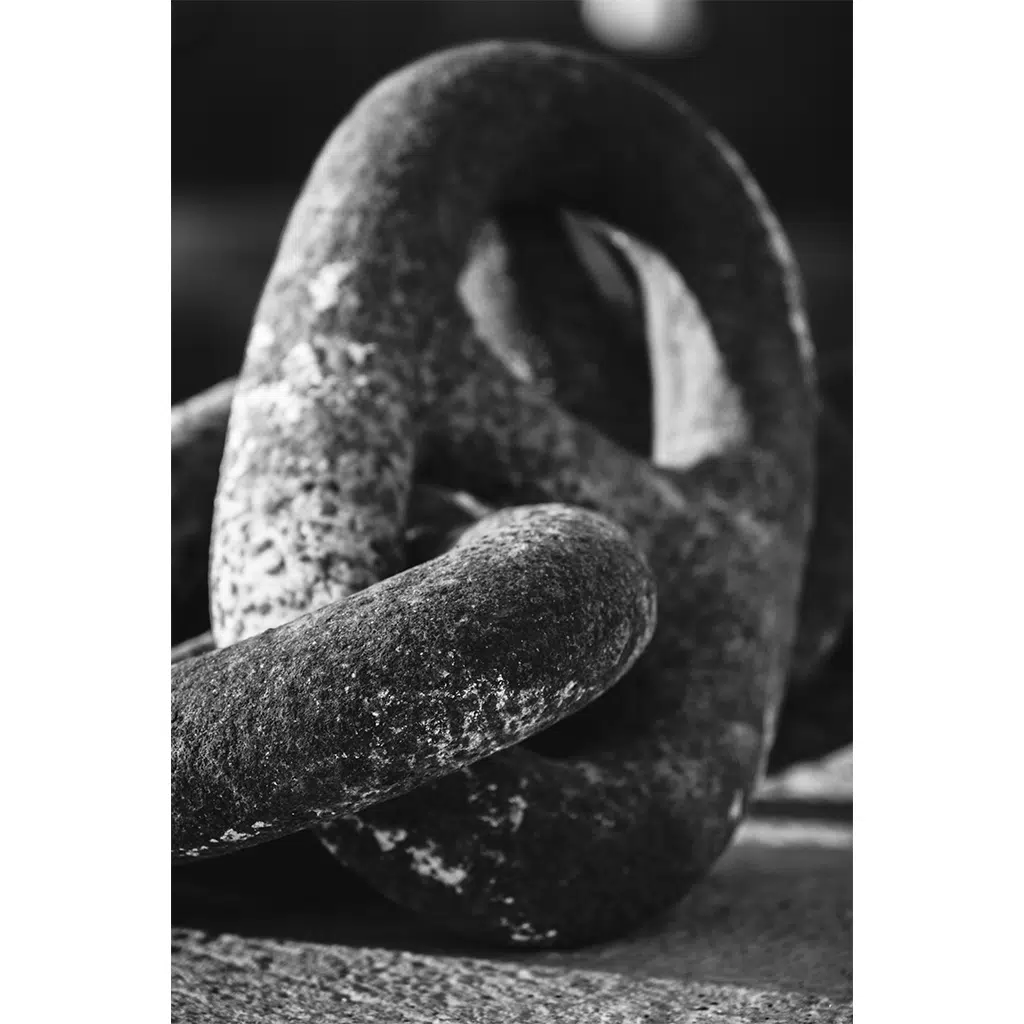 Close-up of a weathered metal chain link