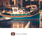 Colorful wooden fishing boat moored at sunset