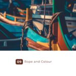 Rope tied around colorful wooden boats