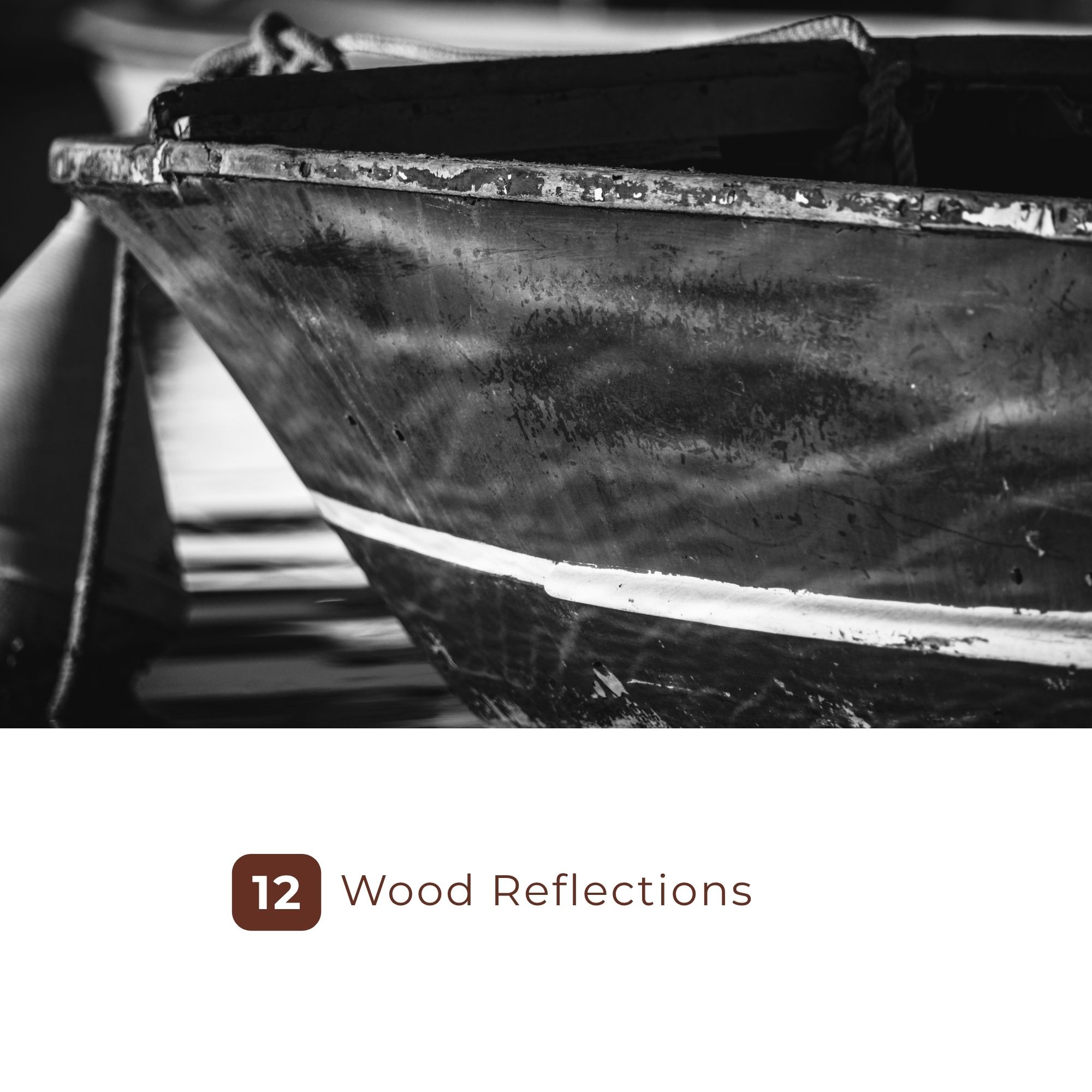 Black-and-white close-up of a weathered wooden boat