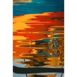 Colorful boat reflections rippling across blue water