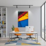 Modern office with abstract art and orange chairs