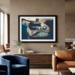Framed rowboat artwork above modern living room console