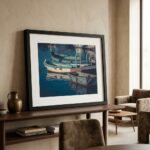 Framed boat photograph on wooden console in living room