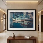 Framed painting of boats displayed in elegant hallway