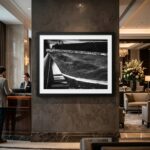 Framed black-and-white boat photograph in elegant hotel lobby