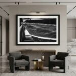 Modern lounge with black-and-white boat photograph