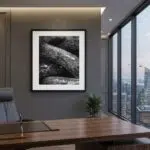 Modern executive office with city skyline and framed rock photograph