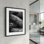 Framed black-and-white rock photograph in modern interior