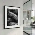 Framed black-and-white rock photograph in modern interior