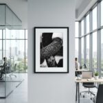 Framed black-and-white abstract photograph in modern office