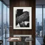 Framed black-and-white abstract photograph in modern office