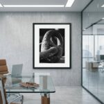 Framed black-and-white sculpture photograph in modern office