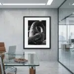 Framed black-and-white sculpture photograph in modern office