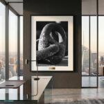 Framed black-and-white sculpture photograph in modern office