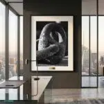 Framed black-and-white sculpture photograph in modern office