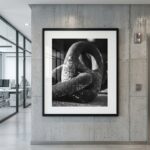 Framed black-and-white abstract sculpture photograph in modern office