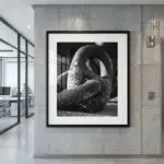 Framed black-and-white abstract sculpture photograph in modern office