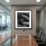 Framed black-and-white rock photograph in modern conference room