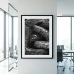 Framed black-and-white stone photograph in modern office