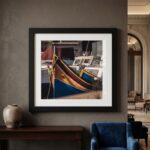 Framed colorful boat photograph above console table