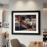 Framed colorful boat photograph in a modern cafe