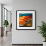 Framed colorful water reflection artwork in modern office hallway