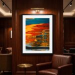 Colorful abstract water reflection artwork above leather chair