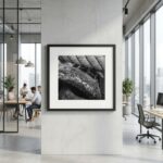 Framed black-and-white abstract photograph in modern office