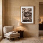 Cozy reading nook with armchair, lamp, and framed art