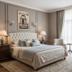 Elegant neutral bedroom with tufted bed and armchair